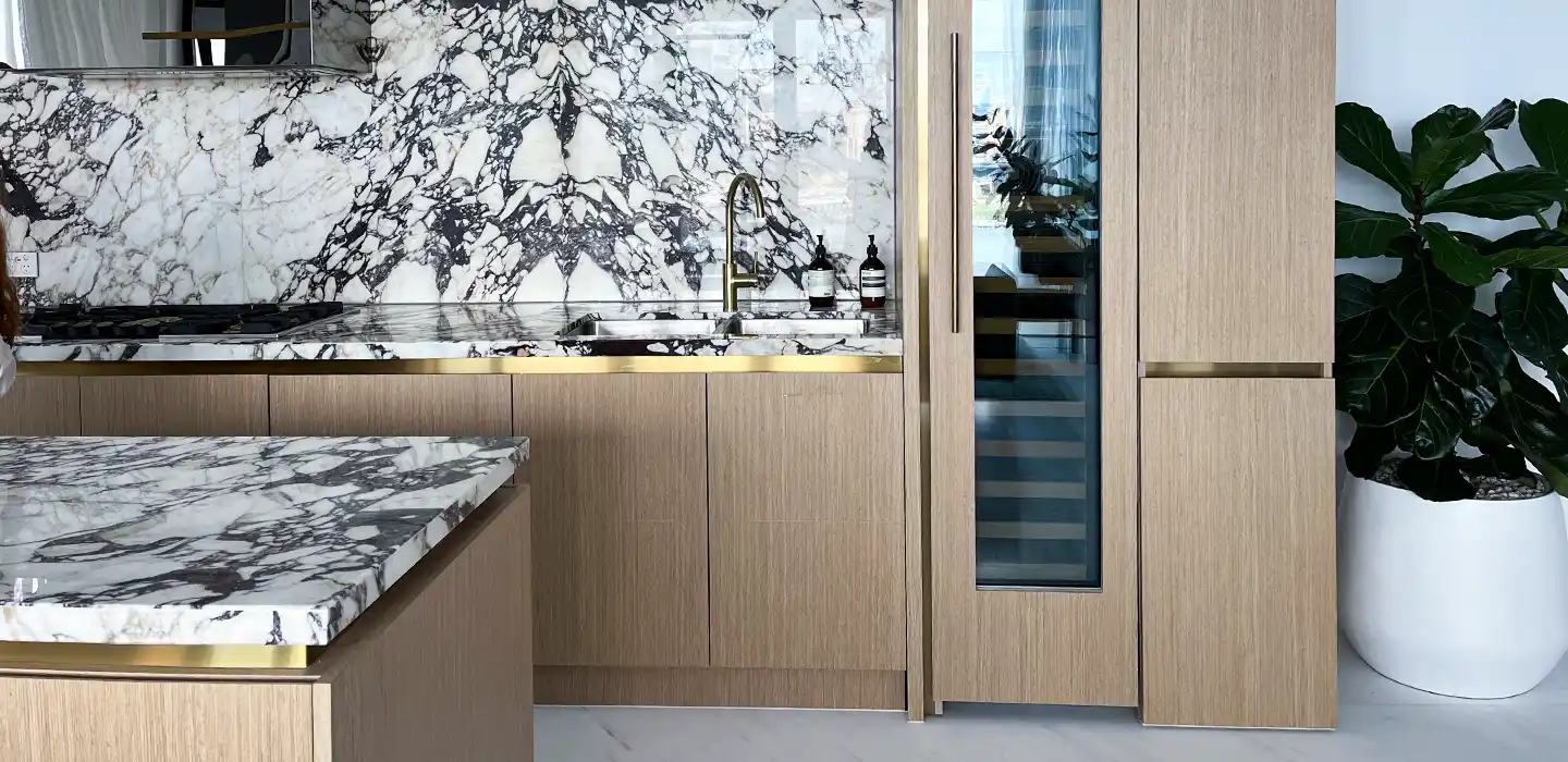 contemporary wood kitchen with brass accents